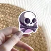 Vibrant Skull Bones Halloween Vinyl Sticker – scratch and UV resistant waterproof decal for water bottle, journal & more