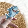 Smiling great white shark waving, waterproof vinyl sticker