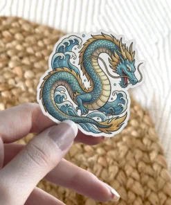 Blue and gold sea dragon artwork adorns this waterproof vinyl sticker, perfect for water bottles and laptops.