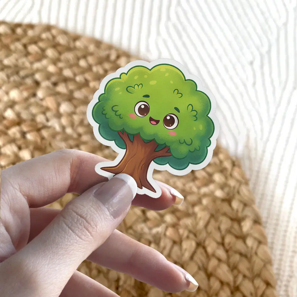 A cute, smiling cartoon tree sticker with bright green leaves and a brown trunk, featuring rosy cheeks and big, expressive eyes.