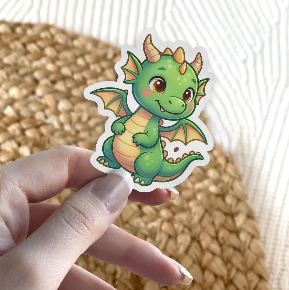 A cute, cartoon-style green baby dragon with orange wings and golden horns, smiling.