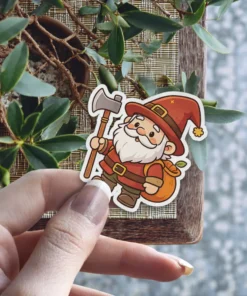 A cute cartoon gnome in a red hat holds an axe and a sack over his shoulder while smiling cheerfully.