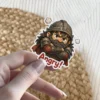 A cartoon dwarf warrior with a large beard, wearing a helmet and armor, crossing his arms with an angry expression, and the word 'Angry!' written below.