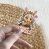 A cute anime bunny girl with a flower crown eats a carrot, with 