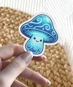 A cheerful, luminous blue mushroom sticker with intricate swirling patterns and a friendly face, perfect for adding a touch of magic.