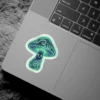 A kawaii glowing mushroom character with a smiling face and intricate swirling patterns, rendered in neon green and blue hues.
