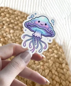 A kawaii jellyfish sticker with a smiling face and flowing tentacles in purple and blue hues, surrounded by small bubbles.