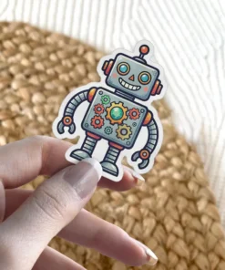 A cute, retro-style robot with visible gears on its chest and a friendly smile is depicted in this vinyl sticker.
