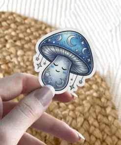 A cute, sleeping mushroom with a crescent moon face and stars on its cap and stem, depicted as a vinyl sticker.