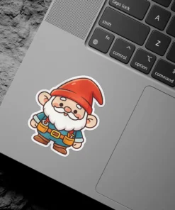 A cute gnome wearing a red hat and blue tunic with tool belt stands smiling.