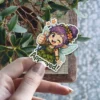 A cute anime-style fairy with purple hair and wings gives a thumbs-up and winks, with the word 'Approved!' below.