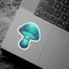A glowing turquoise mushroom sticker with a detailed cap and stem.