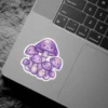 A group of smiling purple mushrooms with kawaii faces and sparkly spots.