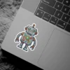 A friendly gray cartoon robot sticker with big blue eyes, a happy smile, and colorful gears on its chest.