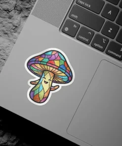 A happy, smiling mushroom sticker designed to look like stained glass with colorful panels.