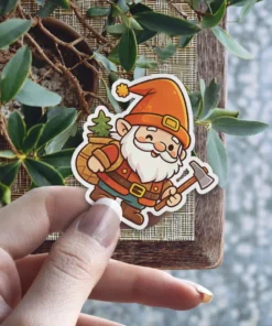 A cheerful cartoon gnome with a white beard winks while carrying a sack with a pine tree and holding a small axe.