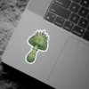 Green mushroom sticker featuring intricate botanical patterns and vibrant green leaves on its cap and stem.