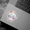 A cute kawaii mushroom character with a rainbow-spotted cap and a happy winking face is shown in this sticker design.