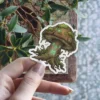 A mystical mushroom sticker with glowing green runes on its stem and mossy cap.