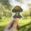 A stylized mushroom with glowing green runes on its stem, adorned with moss and dripping dew.