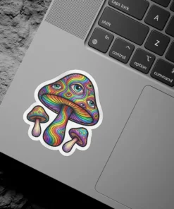 A sticker features a cluster of trippy mushrooms with rainbow-colored caps covered in numerous eyes.