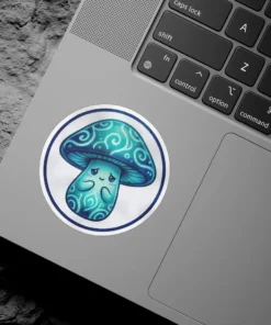 A circular sticker featuring a blue mushroom character with a sad expression and teal swirl patterns on its cap and stem.