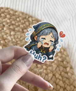 A crying chibi character in a dark cloak with gold trim, featuring a broken heart and the word 'Huh?'.