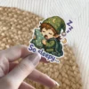 A chibi elf in starry green pajamas and a nightcap is sleeping soundly while hugging a pillow with the text So sleepy below.