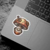 A whimsical sticker depicts a steampunk-style mushroom with copper plating, gears, and a circular glass window.