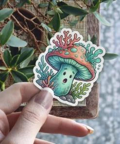 A whimsical sticker of a surprised-looking mushroom character adorned with coral and sea plants.