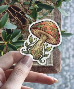 A detailed illustration of a whimsical mushroom with intricate swirling vine patterns on its cap and stem, surrounded by delicate leaves.