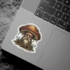 A fantasy art sticker depicts a wise old mushroom man with a long white beard and a weathered face, wearing a mushroom cap as a hat.