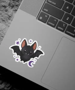 A smiling black bat surrounded by small purple stars and a crescent moon makes for a durable vinyl sticker.
