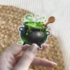 Cartoon frog in bubbling green potion, black cauldron, wooden spoon with pentagram, green drips, magical brew vinyl sticker.