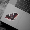 Gothic vampire bat, glowing red eyes, dripping wings, jeweled collar, spooky horror art vinyl sticker.