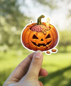 Cartoon jack-o-lantern sticker, carved face, pink brain, almonds, lit candle inside, spooky Halloween vinyl sticker.
