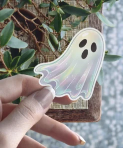 Iridescent pearlescent ghost character, black expressive eyes, mouth, die cut, holographic finish, vinyl sticker.