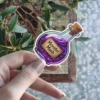 Purple glowing potion bottle, cork stopper, Monster Mash parchment label, magical elixir, vinyl sticker.