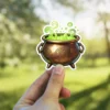 Detailed bronze cauldron sticker, vibrant green bubbling potion, wispy magical vapor, intricate arcane symbols, sturdy three-legged design, mystical vinyl sticker.