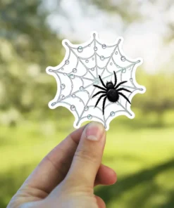 Black spider, dew covered web, intricate web design, nature inspired, insect illustration, vinyl sticker