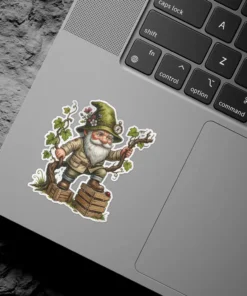 A sticker featuring a detailed illustration of a garden gnome wearing a green hat adorned with flowers and a small compass, holding onto a grape vine.